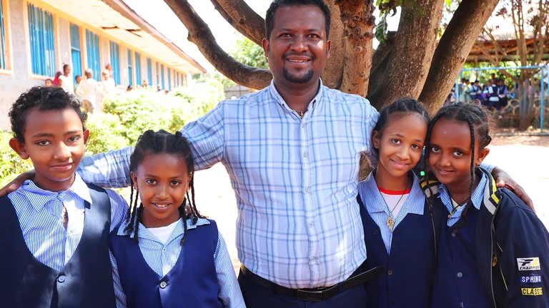 Tesfaye with students